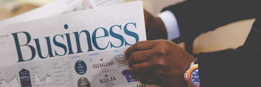 man reading business section