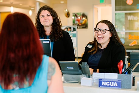 Three employees talking together