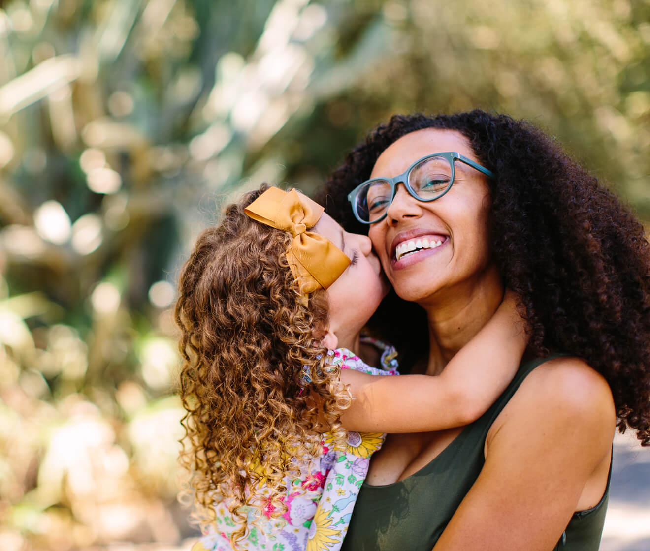 Smiling mother holding her daughter.